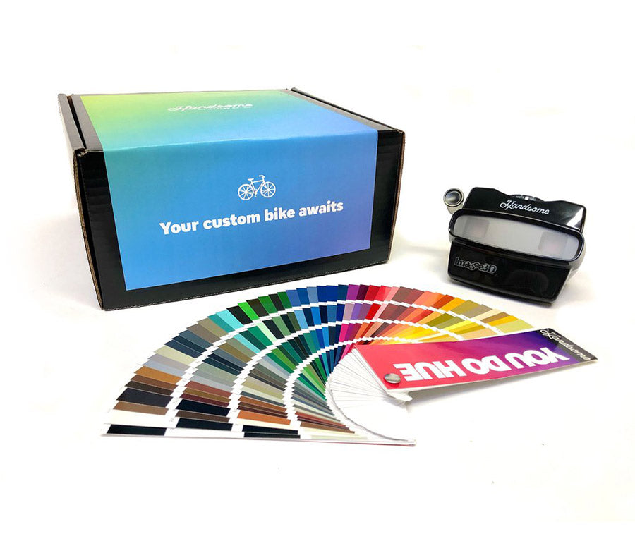 Image of custom color box. Containing a color swatch book and a headset.